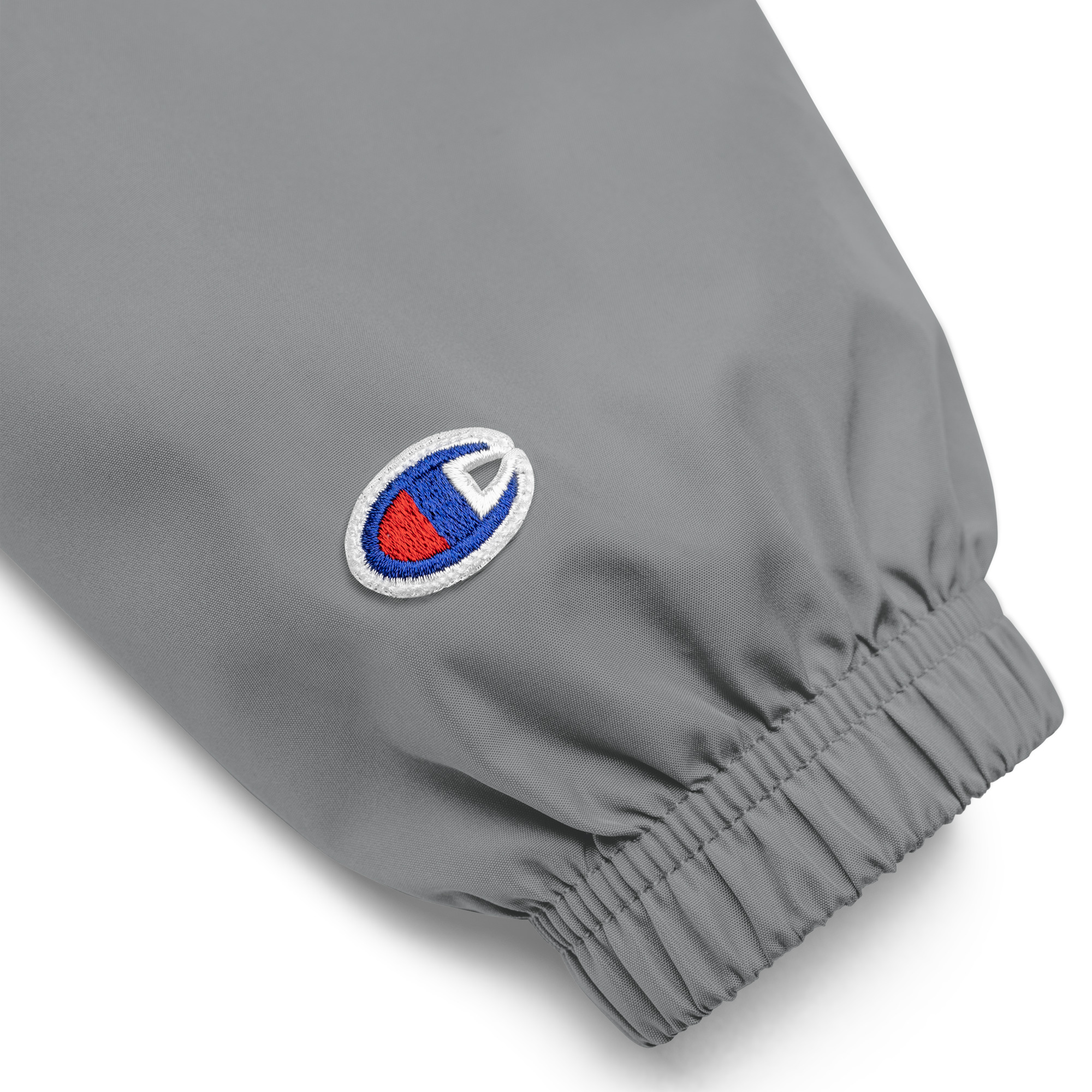 embroidered-champion-packable-jacket-graphite-product-details-68e3e3ffebaaa.jpg